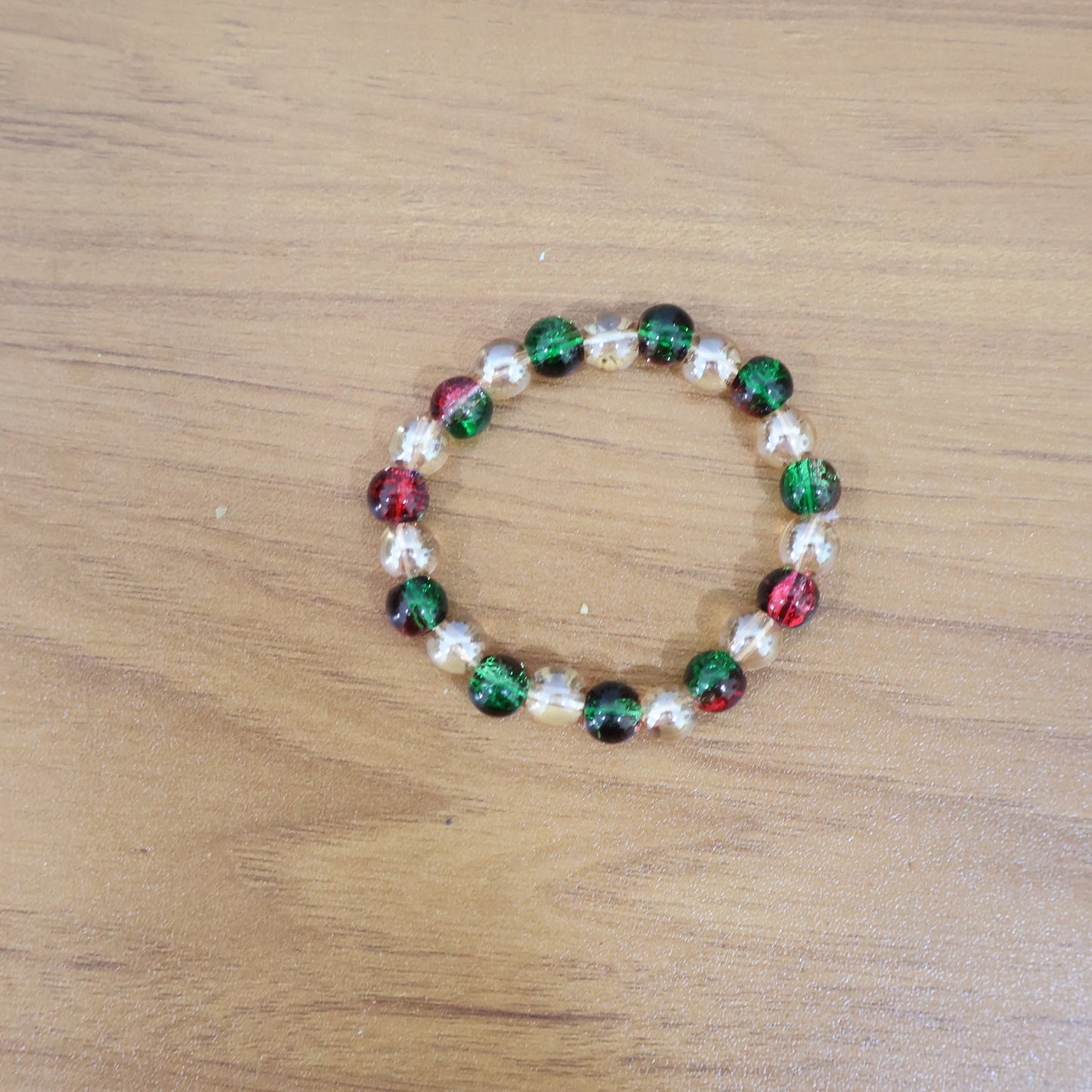 Live styling image of glossy multicolor bead stretch bracelet on wrist