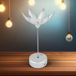 An elegant Lotus Flower Lamp with its petals fully open, emitting a warm glow and ready to play music.