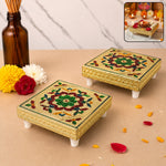 A vibrant multicoloured wooden pooja chowki, handcrafted with traditional Indian designs, displayed on a white background.