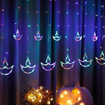 Vibrant multicolor Diya Curtain String Lights illuminating a festive window.