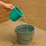 Spill-resistant pouring spout on plastic bath mug