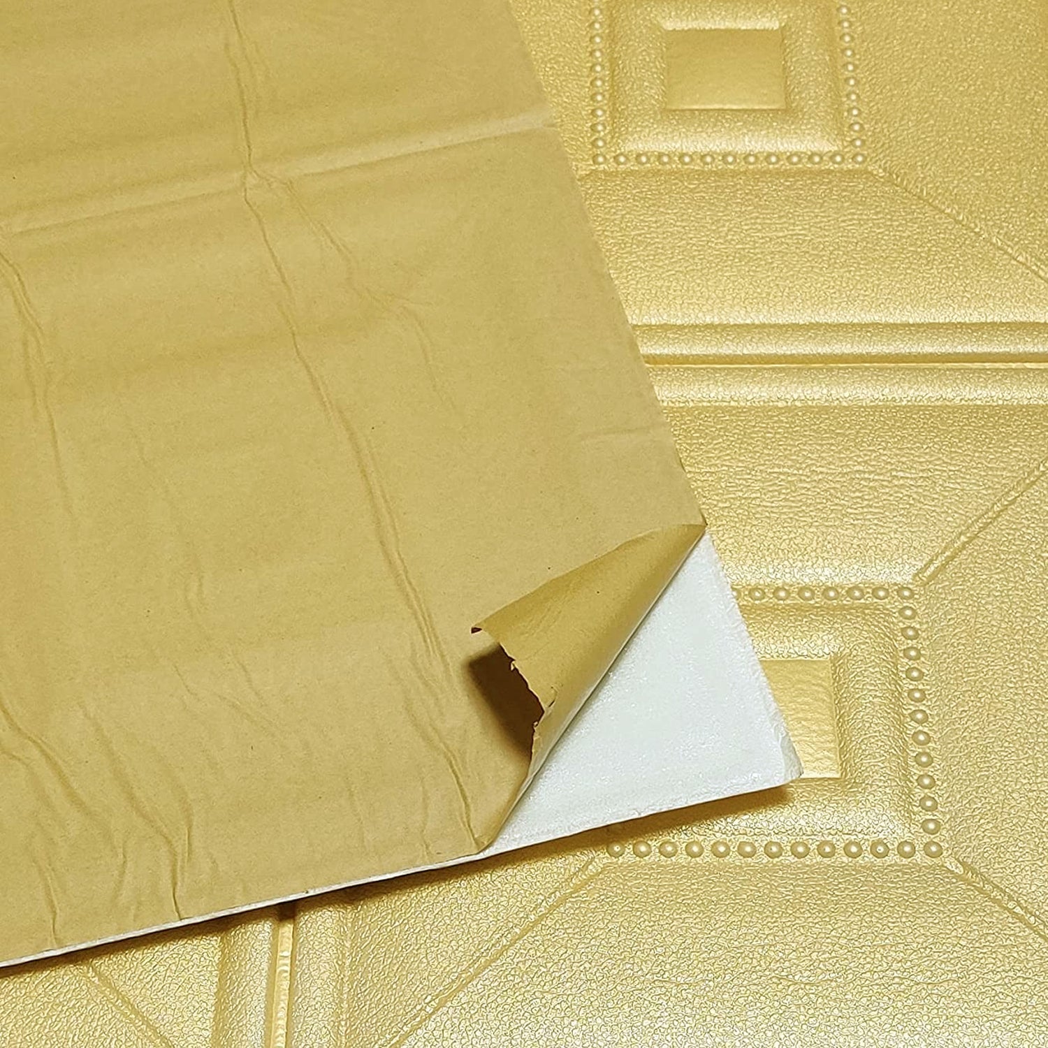 View of a single foam wallpaper sticker demonstrating its texture.