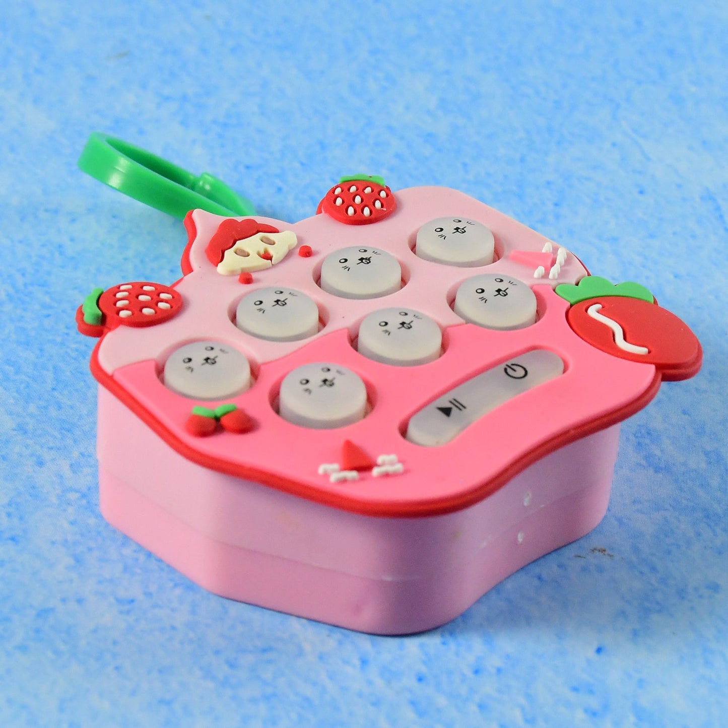 Cute strawberry keychain toy designed for fidgeting and focus