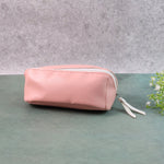 Compact PU leather travel organizer pouch filled with makeup brushes and stationery.