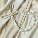 Stylish window drapery tieback featuring pearl beads