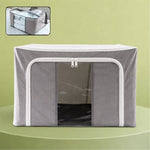 Foldable storage bag with a clear window displaying organized clothes, ready for home storage.