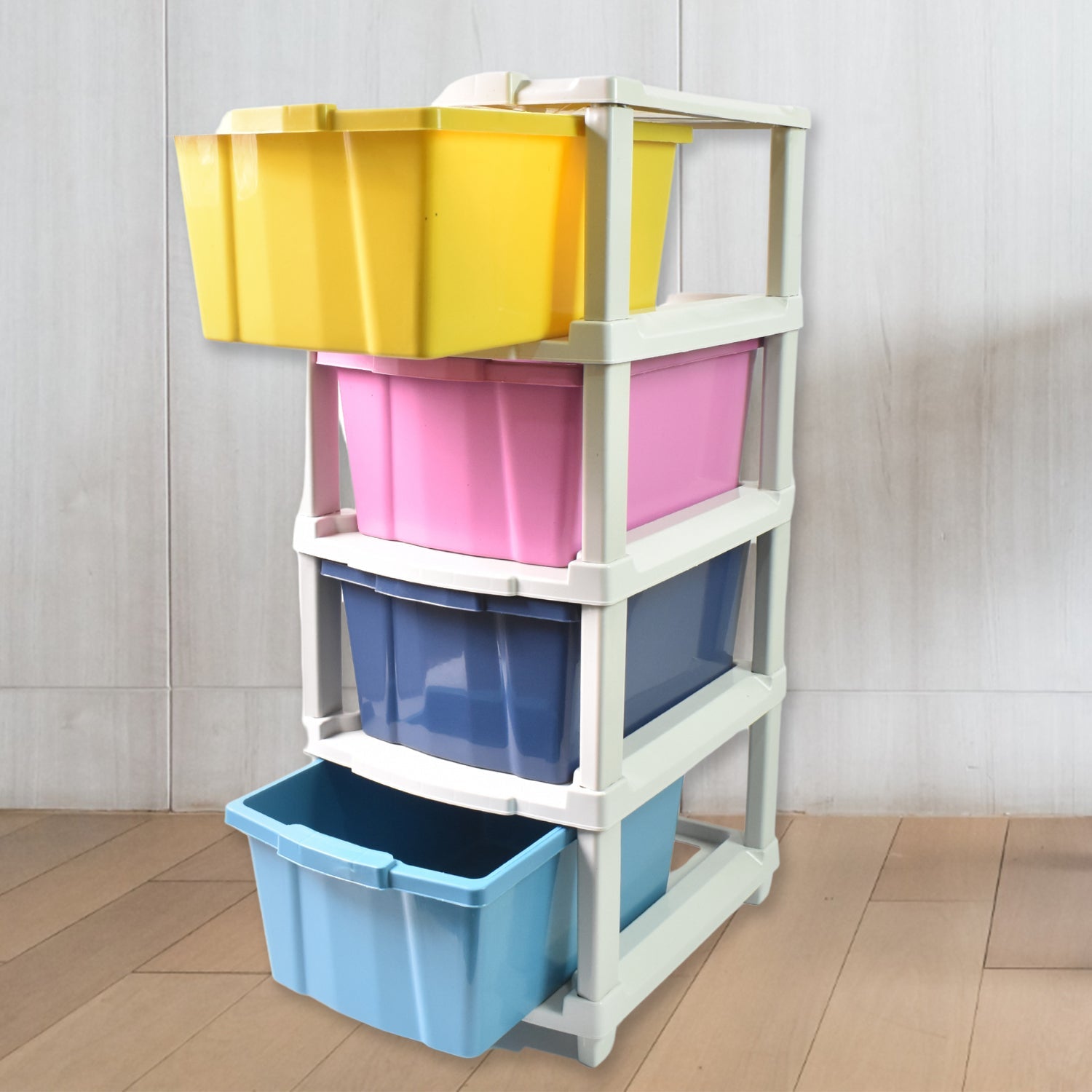 A practical plastic drawer organizer filled with various household items, demonstrating its storage capacity.