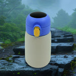 Sleek smart water bottle in a neutral color, front view.