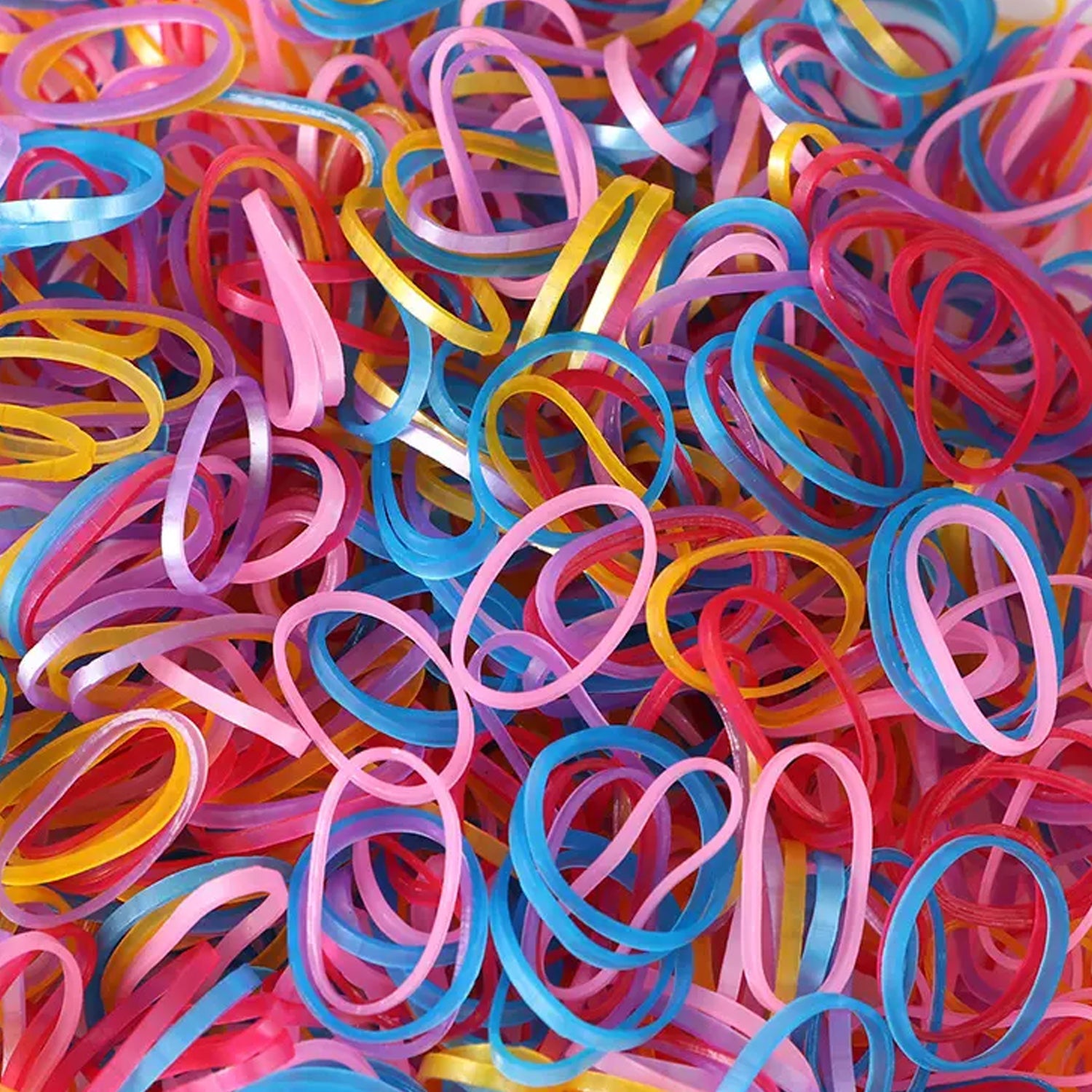 Multicolor elastic rubber bands neatly organized for office and home use.