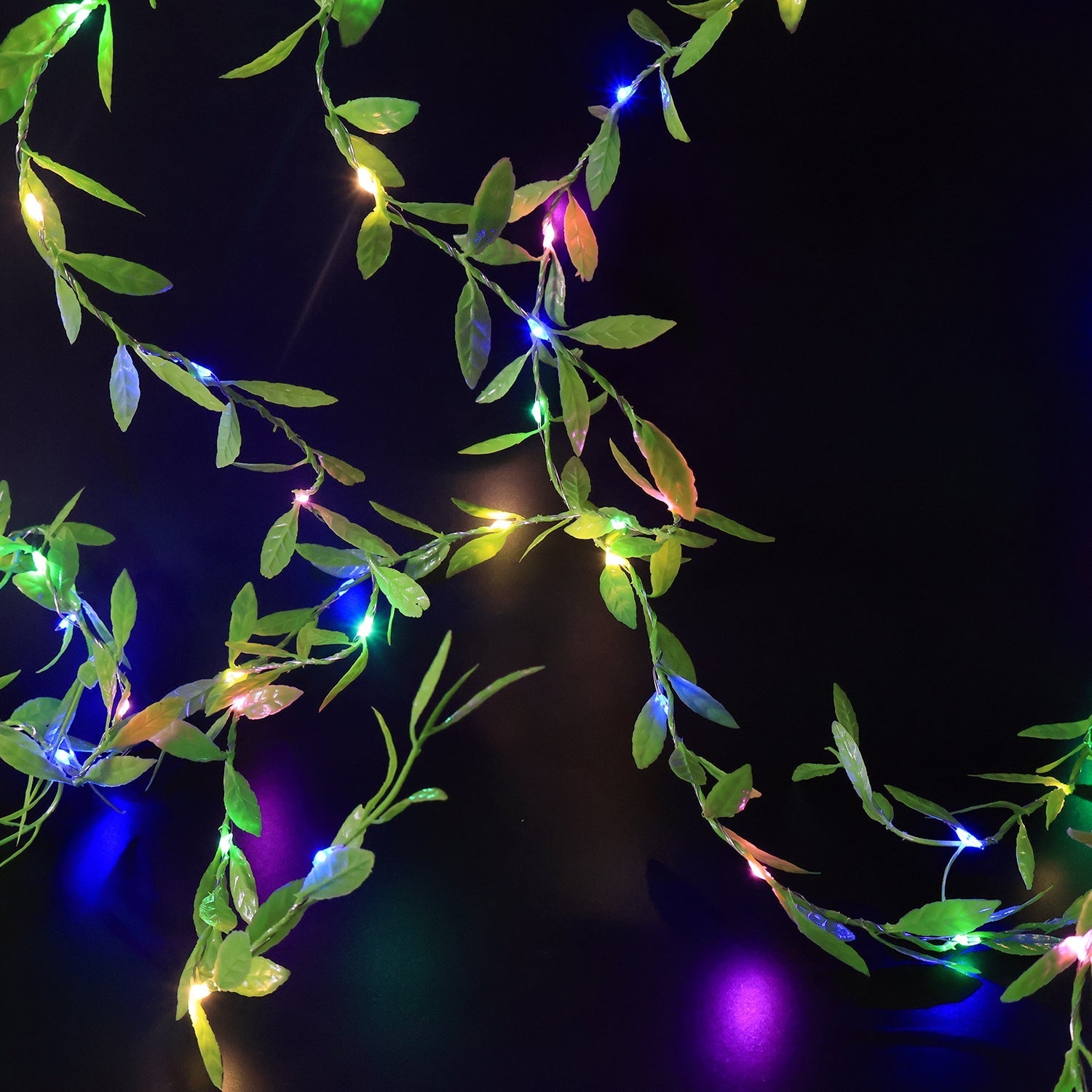 Hanging LED leaf string light illuminating balcony or garden space