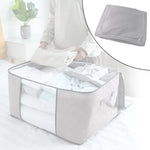Storage box with window neatly organizing sarees and quilts inside wardrobe