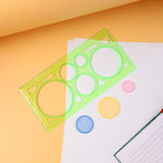 Spirograph geometry design ruler with circular tracks and stencil shapes