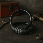 Resettable combination dial on self coiling bike cable lock