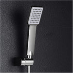 Person holding the handheld shower head, demonstrating its easy grip and versatile use.
