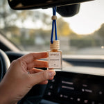 Close-up of the natural wooden cap on Siyera Sandalwood Car Perfume bottle.