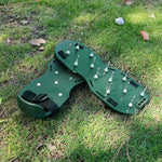 Close-up of the durable steel spikes on the Lawn Aerator Sandals for effective grass aeration.