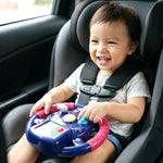 Close-up of child-friendly steering wheel toy featuring bright lights