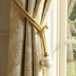 Modern window curtain holder showcasing braided rope and pearl design