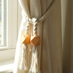 Magnetic curtain band wrapped around a curtain for easy installation.