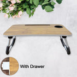  foldable laptop table used for studying with books and a tablet, highlighting its versatility.