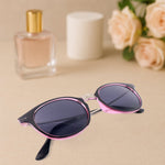 Foldable sunglasses holder mounted on wall with stylish sunglasses
