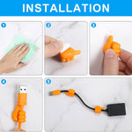 Tangerine-coloured flexible hand grip silicone clip attached to wall