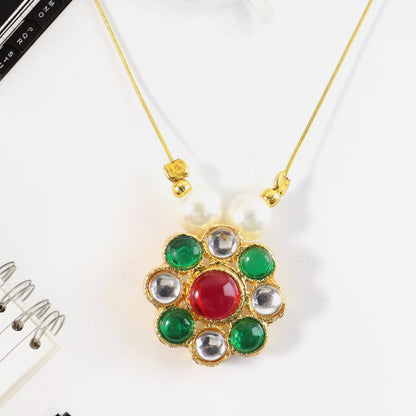 Side angle of multicolor stone floral pendant featuring pearl bead details