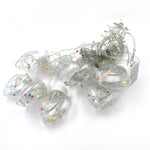 Bright LED wish ball lights creating a warm ambiance for an indoor celebration.