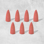 A pack of specialized backflow incense cones, essential for creating the smoke waterfall effect.