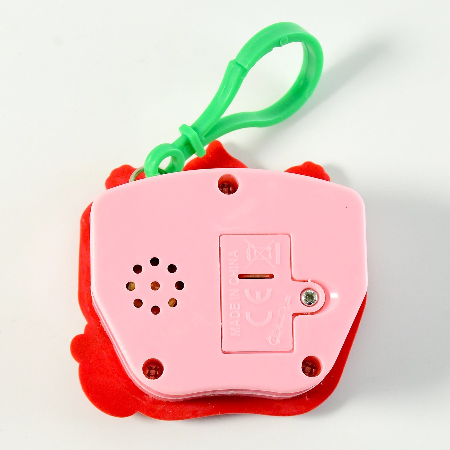 Push button keychain toy attached to a bag loop for stress relief