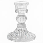 Transparent glass candle holder enhancing home decor ambiance