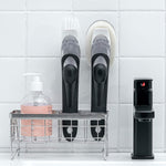 The complete soap dispensing dish brush set, showing the handle and two replacement heads.