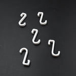 Multi-angle view of the strong self-adhesive plastic hook, highlighting its sleek design.