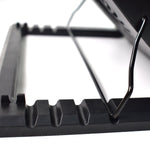 Laptop cooling fan pad with blue LED lights, enhancing the gaming setup.