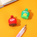 Close-up of the bottle shape pencil sharpener in action, collecting shavings.