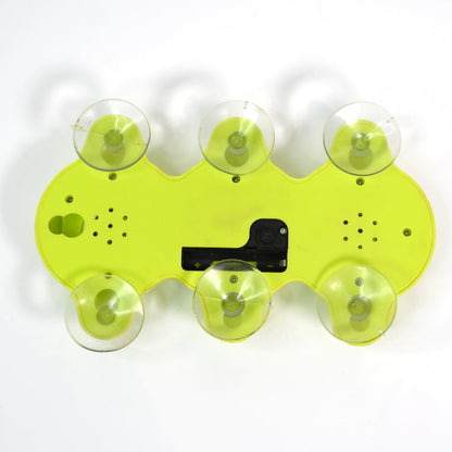 Rear view of the Indo Glow desktop clock showing control buttons and battery compartment.