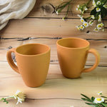 Konvex coffee mugs placed on a wooden table