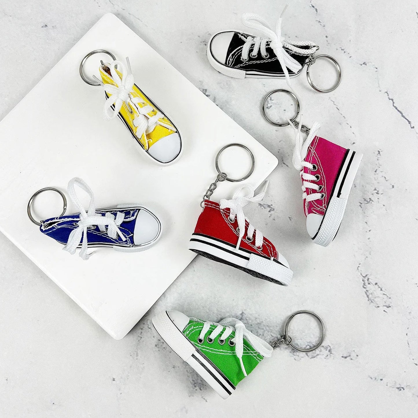 Miniature boot keychain with intricate lacing detail.
