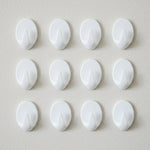 Close up of a strong self adhesive hook showing compact design