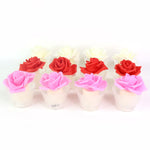 Textured glass holder enhancing the soft glow of rose shaped LED candle
