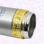 A chilled stainless steel water bottle with condensation, indicating its ability to keep drinks cold.