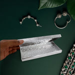 Interior view of decorative silver multipurpose cash box showing storage space