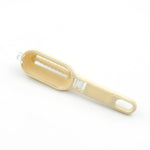 Versatile fish descaler tool demonstrating its 3-in-1 functionality.