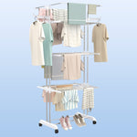 Compact foldable clothes drying rack shown partially folded for storage.