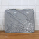 Close-up of the durable double zipper and reinforced handle on the foldable storage bag.