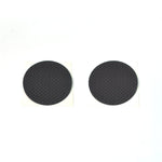 Various sizes of brown felt furniture pads laid out for floor scratch prevention.