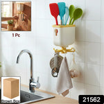 Sticky wall hook holding a kitchen towel for convenient storage
