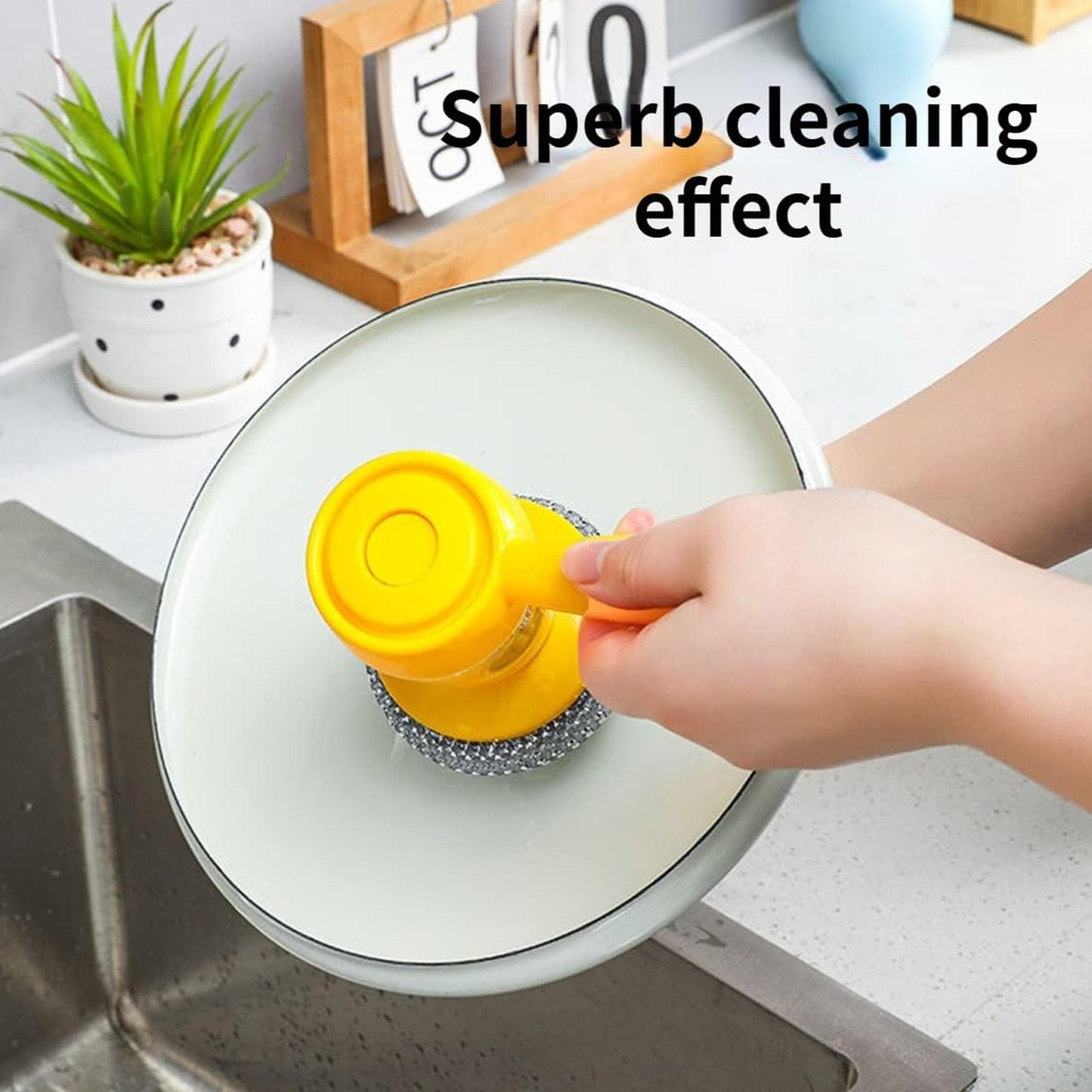 The handheld soap dispenser with scrub brush, ready for use in a clean kitchen setting.