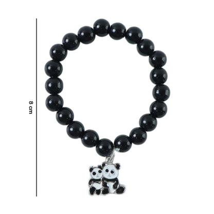 Stylish pastel bead stretch bracelet laid flat highlighting glossy finish and charm