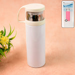 Glossy stainless steel water vacuum bottle placed on wooden surface